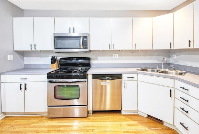 341 S Lancelot Ln, Palatine, IL 60074 - kitchen featuring appliances with stainless steel finishes, light countertops, and white cabinets