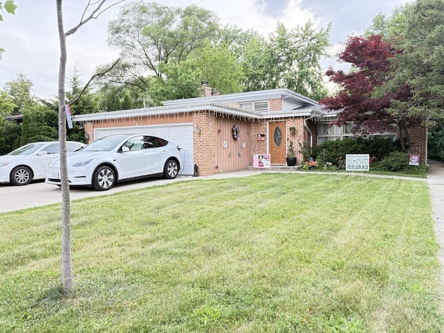 245 Sunset Dr, Wilmette, IL 60091 - split level home featuring an attached garage, brick siding, and a front yard