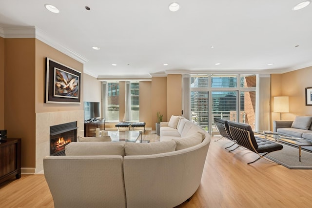 415 E N Water St Unit 806, Chicago, IL 60611 - living area featuring crown molding, a tiled fireplace, light wood-style floors, plenty of natural light, and recessed lighting