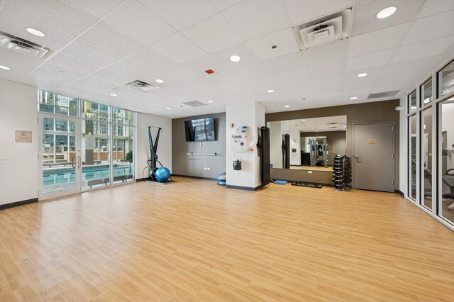 415 E N Water St Unit 806, Chicago, IL 60611 - exercise room with floor to ceiling windows, light wood-type flooring, and a drop ceiling