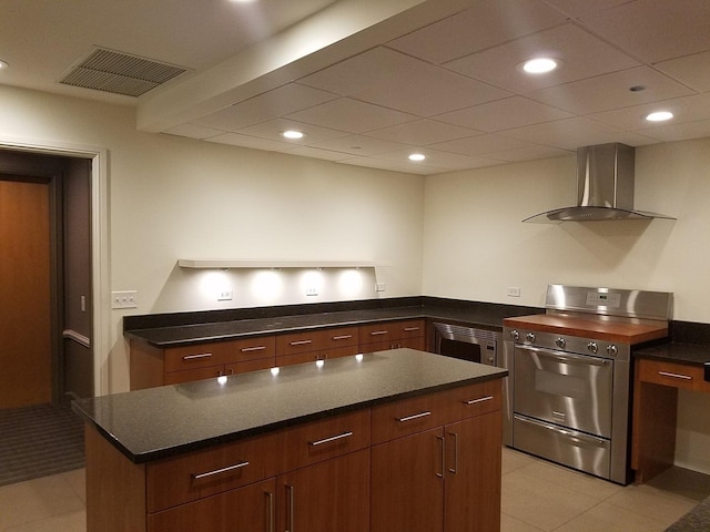 415 E N Water St Unit 806, Chicago, IL 60611 - kitchen with stainless steel appliances, wall chimney exhaust hood, a center island, recessed lighting, and dark stone countertops