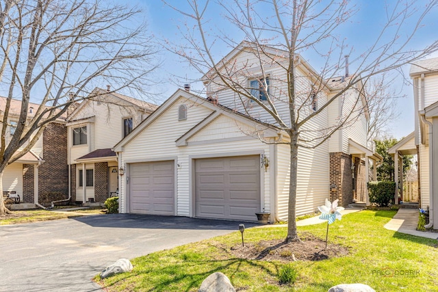 321 E Forest Knoll Dr, Palatine, IL 60074 - traditional home with driveway, a garage, brick siding, and a front yard