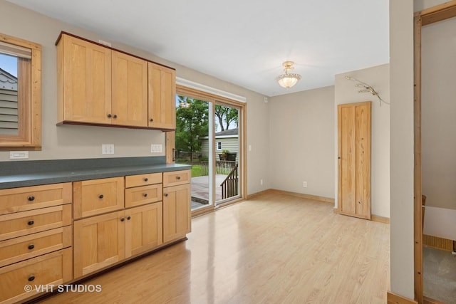 238 Weaver Dr, Cary, IL 60013 - kitchen featuring light wood-style floors, light brown cabinetry, and dark countertops