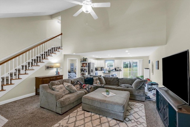 1707 Lydia Ct, Urbana, IL 61802 - living room featuring high vaulted ceiling, stairway, carpet floors, and ceiling fan