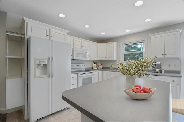 1707 Lydia Ct, Urbana, IL 61802 - kitchen featuring white appliances, white cabinetry, a kitchen island, and recessed lighting