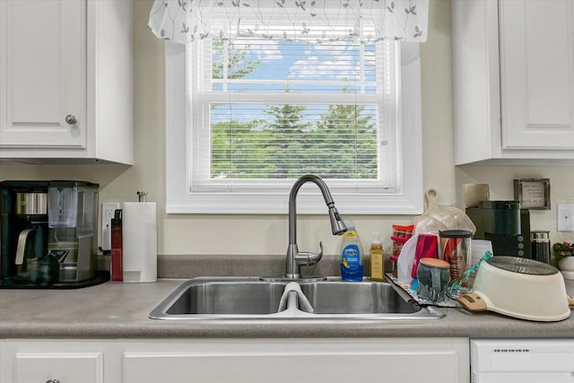 1707 Lydia Ct, Urbana, IL 61802 - kitchen featuring white dishwasher, white cabinetry, and light countertops
