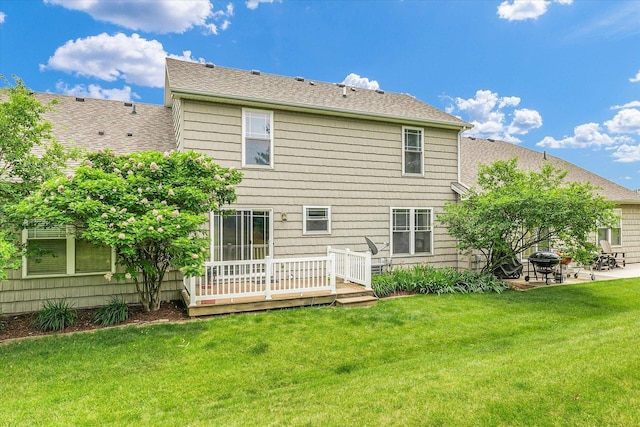 1707 Lydia Ct, Urbana, IL 61802 - rear view of property featuring a lawn, roof with shingles, a wooden deck, and a patio