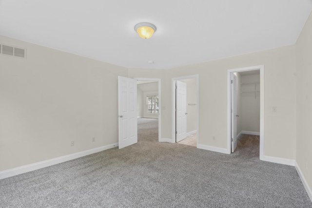 1707 Lydia Ct, Urbana, IL 61802 - unfurnished bedroom featuring carpet and a spacious closet