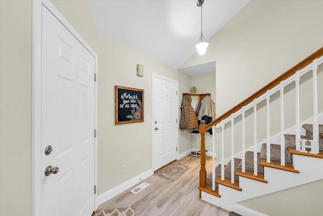 1707 Lydia Ct, Urbana, IL 61802 - foyer entrance with stairs, light wood finished floors, and vaulted ceiling