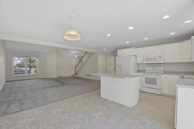 1707 Lydia Ct, Urbana, IL 61802 - kitchen with white appliances, light countertops, white cabinetry, a center island, and recessed lighting