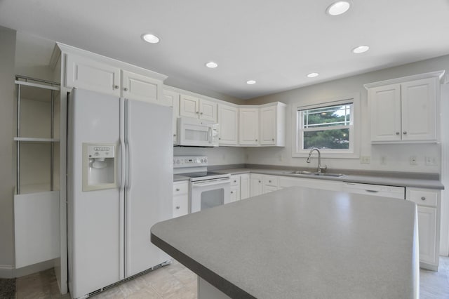 1707 Lydia Ct, Urbana, IL 61802 - kitchen with white appliances, white cabinetry, recessed lighting, and a center island