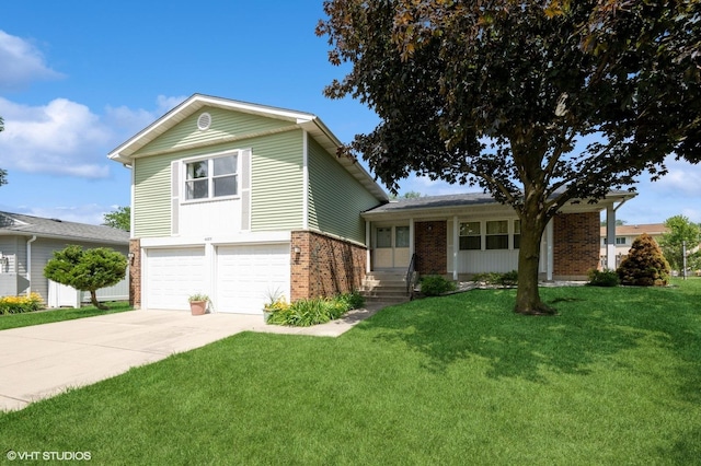4085 N New Britton Dr, Hoffman Estates, IL 60192 - view of front of home featuring brick siding, an attached garage, a front yard, and concrete driveway