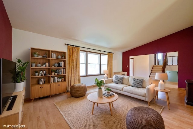4085 N New Britton Dr, Hoffman Estates, IL 60192 - living room with lofted ceiling, light wood-type flooring, and stairs