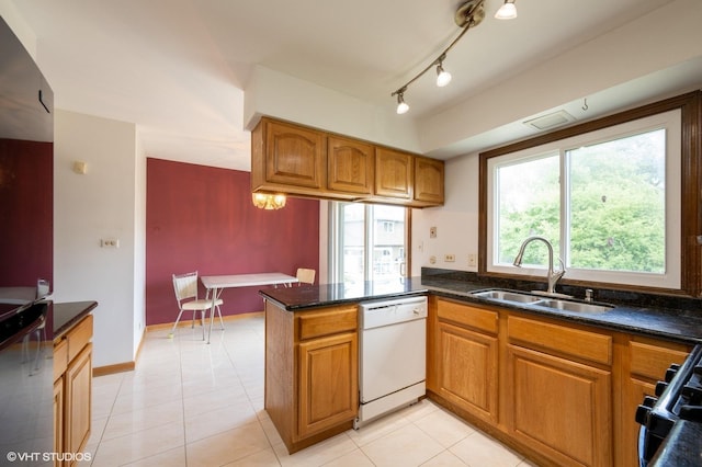4085 N New Britton Dr, Hoffman Estates, IL 60192 - kitchen with white dishwasher, brown cabinets, dark stone counters, and light tile patterned flooring