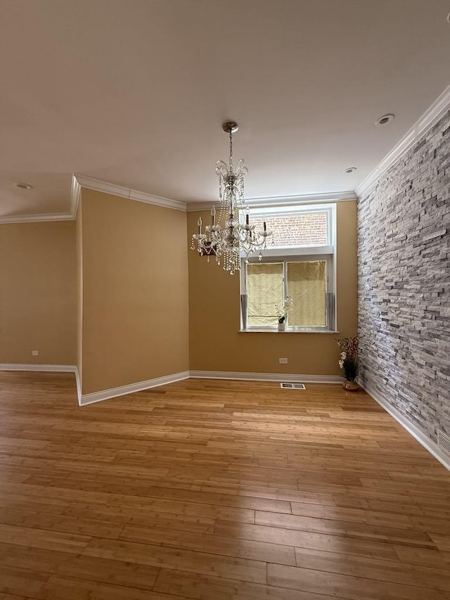 5632 S Peoria St, Chicago, IL 60621 - unfurnished dining area featuring crown molding, a chandelier, and wood finished floors
