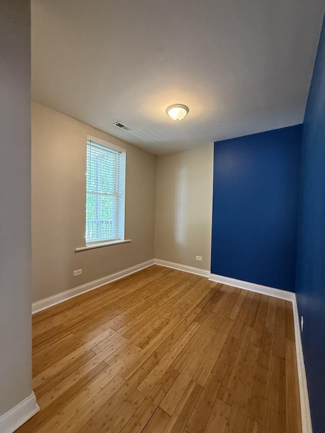 5632 S Peoria St, Chicago, IL 60621 - spare room featuring hardwood / wood-style floors and baseboards