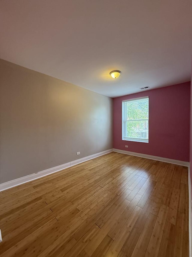 5632 S Peoria St, Chicago, IL 60621 - unfurnished room with baseboards and light wood finished floors