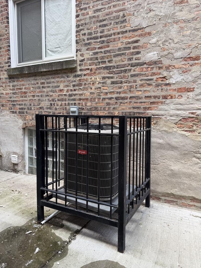 5632 S Peoria St, Chicago, IL 60621 - exterior view of brick siding and a central AC unit