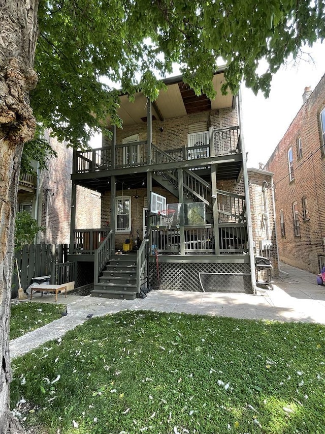 5632 S Peoria St, Chicago, IL 60621 - view of front of house featuring stairs, brick siding, a deck, and a patio area
