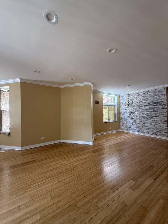 5632 S Peoria St, Chicago, IL 60621 - empty room with crown molding, light wood finished floors, a chandelier, and recessed lighting