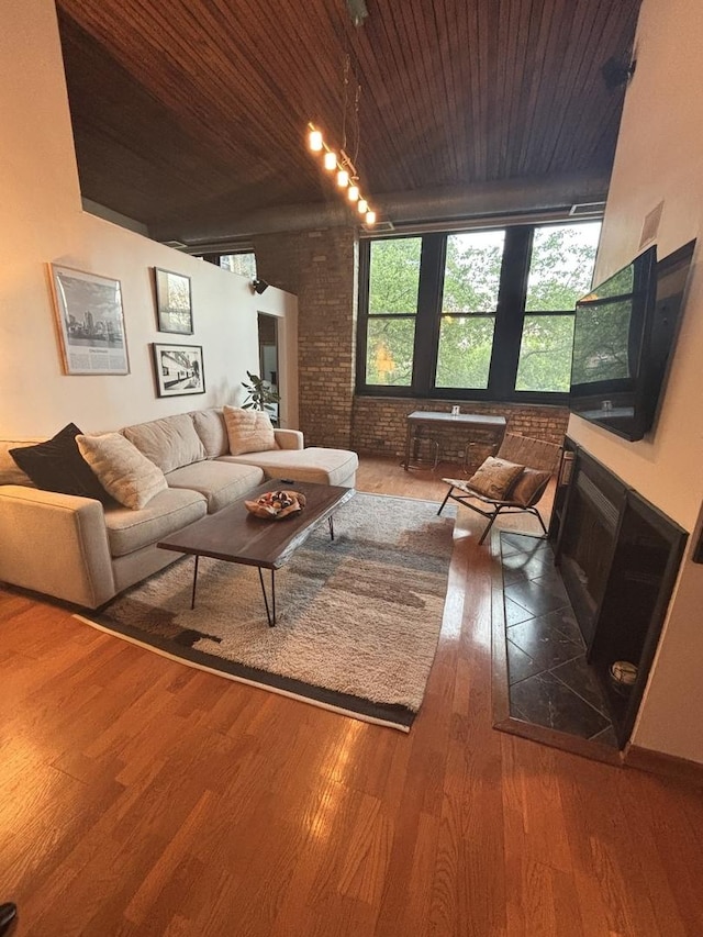 2510 N Wayne Ave Unit 203, Chicago, IL 60614 - living area with wooden ceiling, wood finished floors, brick wall, and a fireplace