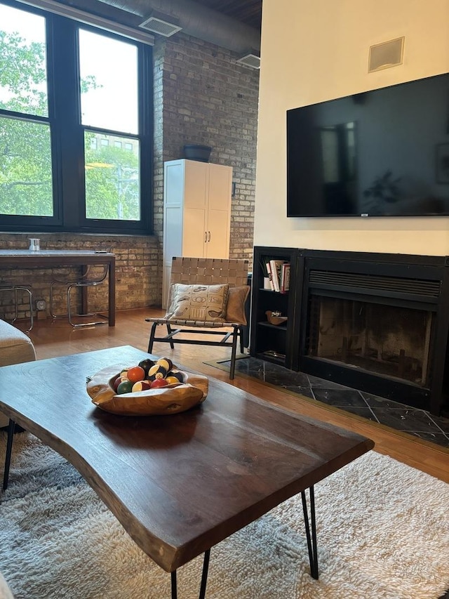 2510 N Wayne Ave Unit 203, Chicago, IL 60614 - living room featuring wood finished floors and a fireplace