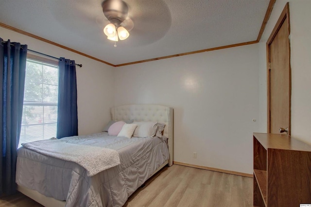 701 Dudley St, Liberty, IL 62347 - bedroom with light wood-type flooring, ornamental molding, ceiling fan, and a textured ceiling