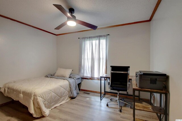 701 Dudley St, Liberty, IL 62347 - bedroom with ornamental molding, wood finished floors, a textured ceiling, a desk, and ceiling fan