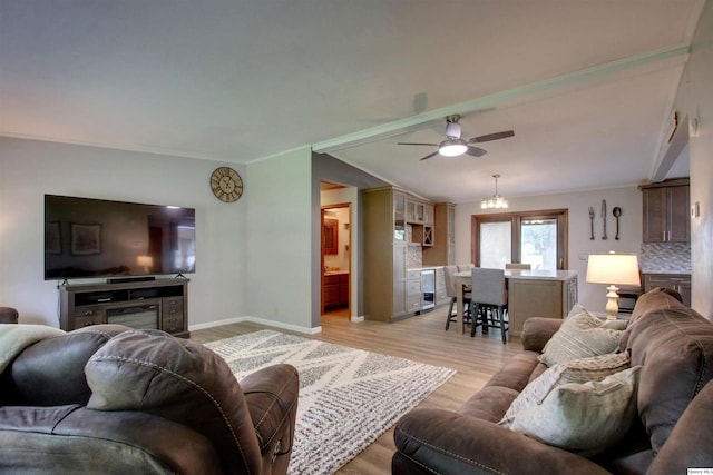 701 Dudley St, Liberty, IL 62347 - living area with wine cooler, light wood-type flooring, a ceiling fan, ornamental molding, and lofted ceiling