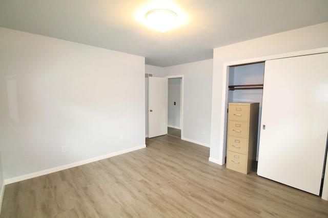 9682 Orr Ln, Winnebago, IL 61088 - unfurnished bedroom with wood finished floors and a closet