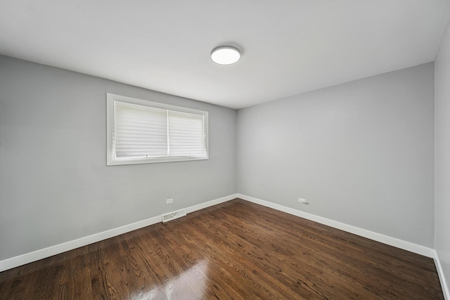 9401 S Sangamon St, Chicago, IL 60620 - unfurnished room with baseboards and dark wood-type flooring
