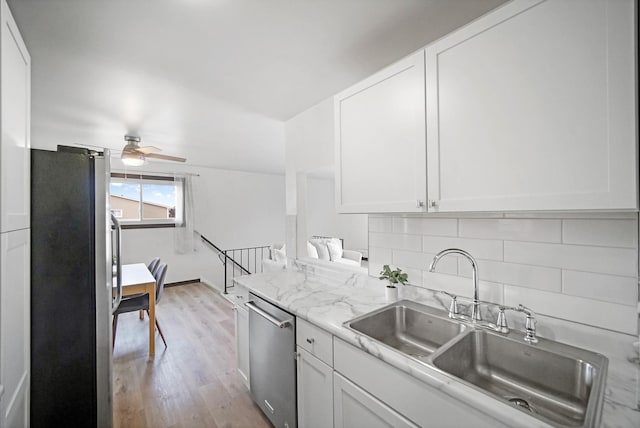7927 164th Pl Unit 236, Tinley Park, IL 60477 - kitchen with stainless steel appliances, white cabinets, tasteful backsplash, light wood-type flooring, and ceiling fan