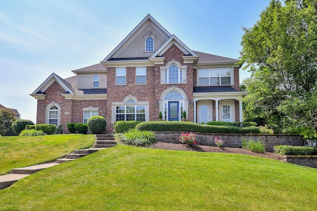 624 Pottawatomie Trl, Batavia, IL 60510 - colonial home featuring brick siding and a front lawn