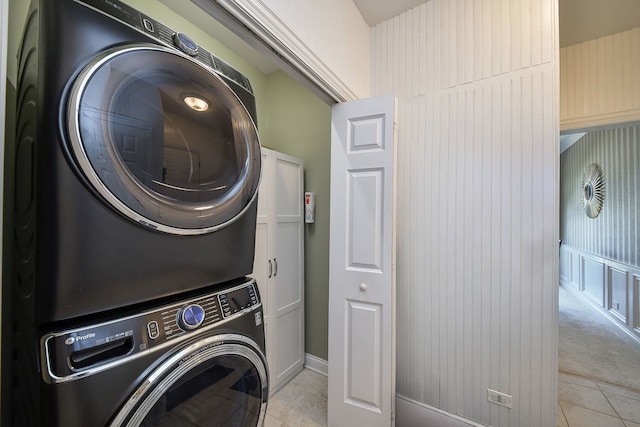 624 Pottawatomie Trl, Batavia, IL 60510 - washroom with stacked washer / dryer and light tile patterned floors