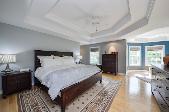 624 Pottawatomie Trl, Batavia, IL 60510 - bedroom featuring a raised ceiling, light wood-style flooring, crown molding, and ceiling fan