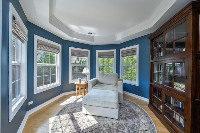 624 Pottawatomie Trl, Batavia, IL 60510 - sitting room featuring a tray ceiling, plenty of natural light, light wood-type flooring, and ornamental molding