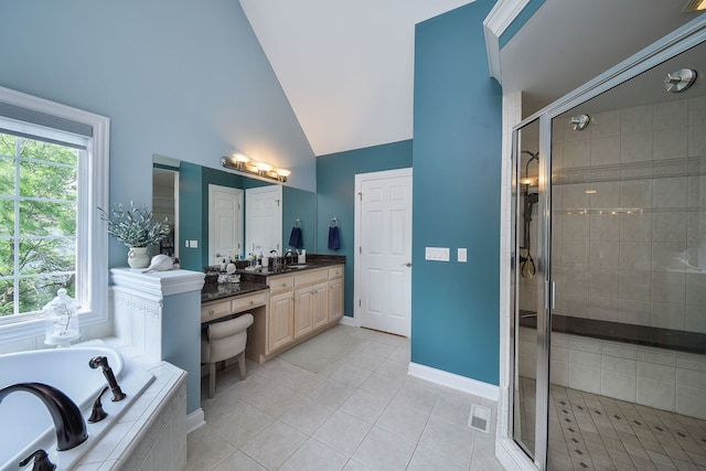 624 Pottawatomie Trl, Batavia, IL 60510 - bathroom featuring a bath, vanity, a stall shower, vaulted ceiling, and tile patterned floors