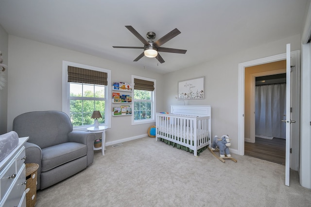 624 Pottawatomie Trl, Batavia, IL 60510 - bedroom with carpet, a crib, and a ceiling fan