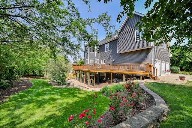 624 Pottawatomie Trl, Batavia, IL 60510 - rear view of property featuring a wooden deck, a garage, stairs, and a lawn