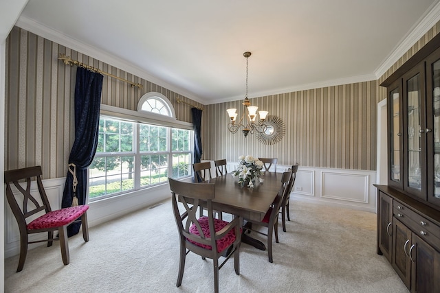 624 Pottawatomie Trl, Batavia, IL 60510 - dining space featuring a chandelier, light carpet, plenty of natural light, wallpapered walls, and crown molding