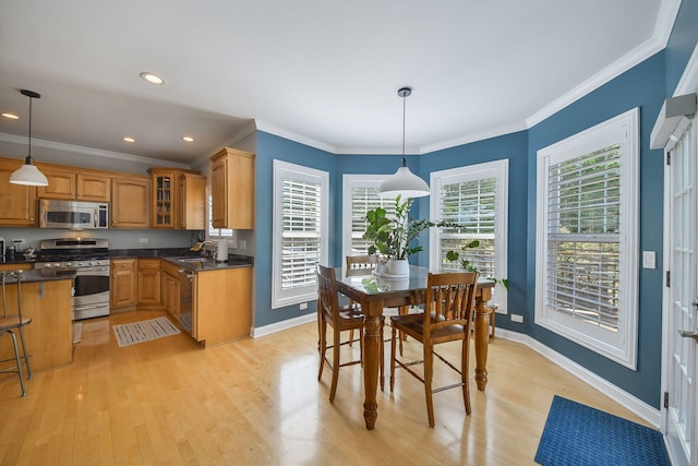 624 Pottawatomie Trl, Batavia, IL 60510 - kitchen featuring stainless steel appliances, dark countertops, brown cabinetry, light wood-type flooring, and glass insert cabinets