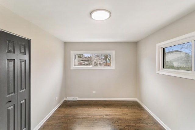 326 W Hawthorne Blvd, Mundelein, IL 60060 - empty room with dark wood-style floors and baseboards