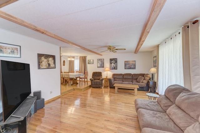 449 W 6th St, Braidwood, IL 60408 - living area with beam ceiling, light wood-style flooring, a chandelier, and a ceiling fan