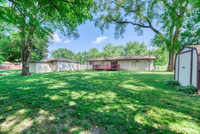 449 W 6th St, Braidwood, IL 60408 - view of green lawn featuring a storage unit and a wooden deck