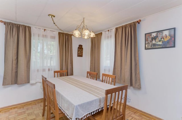 449 W 6th St, Braidwood, IL 60408 - dining area featuring a chandelier and baseboards