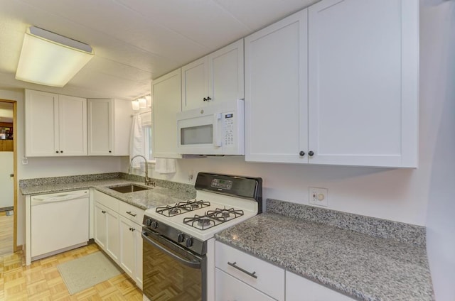 449 W 6th St, Braidwood, IL 60408 - kitchen featuring white appliances, white cabinets, and light stone countertops