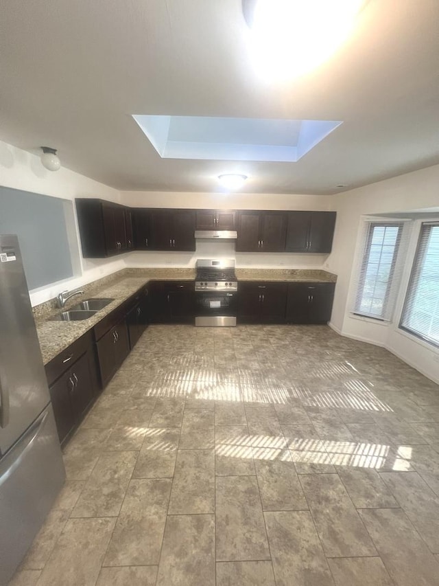 14644 Ellis Ave, Dolton, IL 60419 - kitchen with a skylight, freestanding refrigerator, under cabinet range hood, and range
