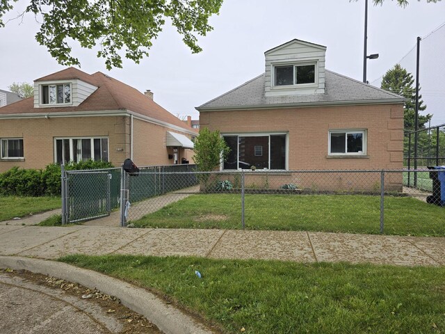 2130 W Highland Ave, Chicago, IL 60659 - view of front of home featuring brick siding and a gate