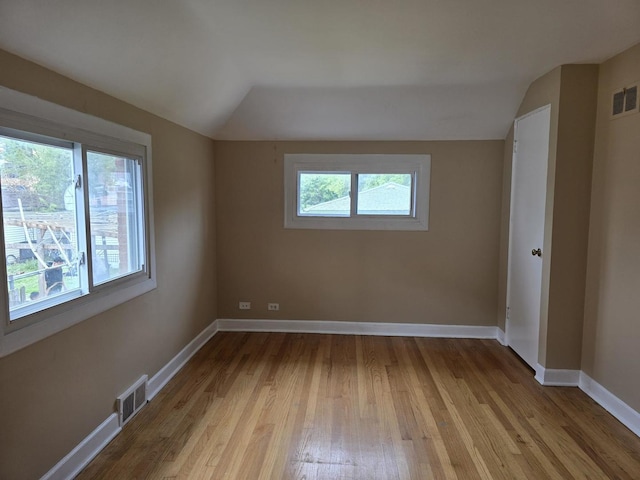 2130 W Highland Ave, Chicago, IL 60659 - spare room featuring lofted ceiling and wood finished floors