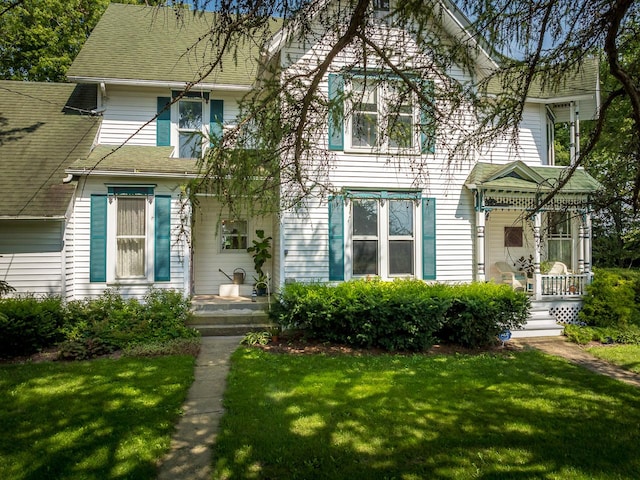 466 Quail Trap Rd, Caledonia, IL 61011 - view of front facade with a front yard, roof with shingles, and a porch